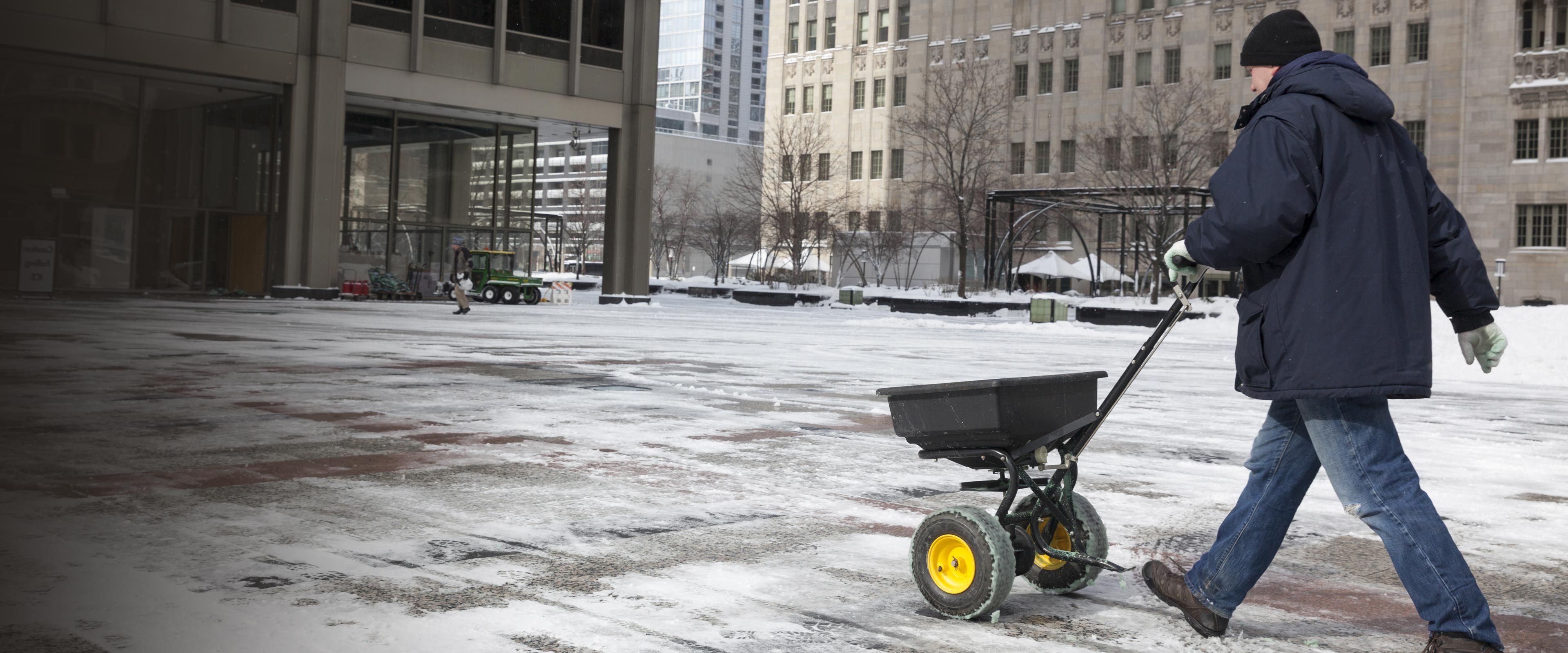 Salt spreader on ice.